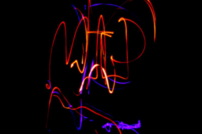 Blurred motion of fire over black background