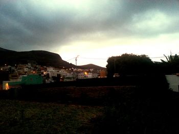 Residential district against cloudy sky