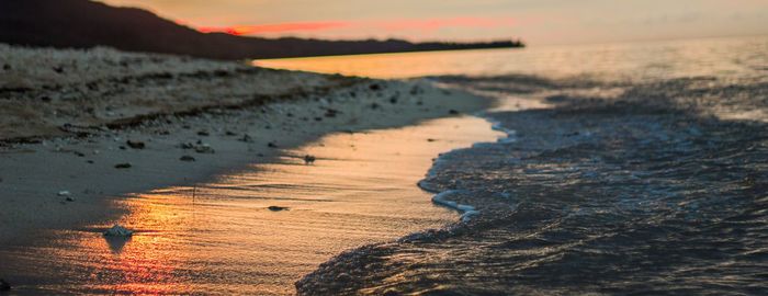 Scenic view of beach during sunset