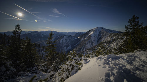 Scenic view of snowcapped mountains against sky