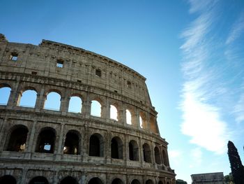 Low angle view of coliseum against sky