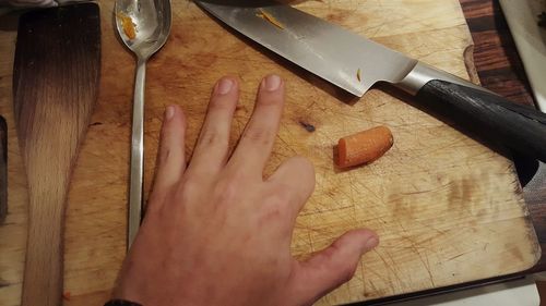 Close-up of human hand on the table