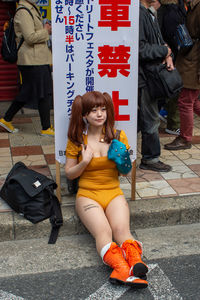 Portrait of woman sitting with text