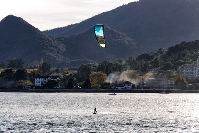 Man kiteboarding in sea