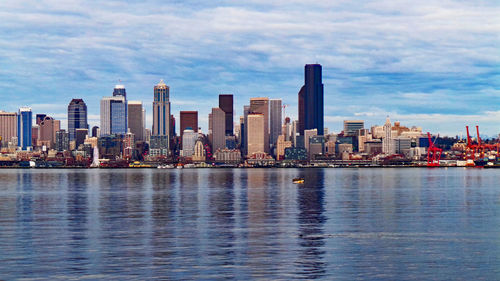 City skyline against cloudy sky