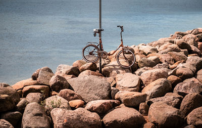 Bicycle on rock at beach