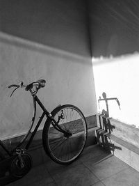 Bicycle parked against wall