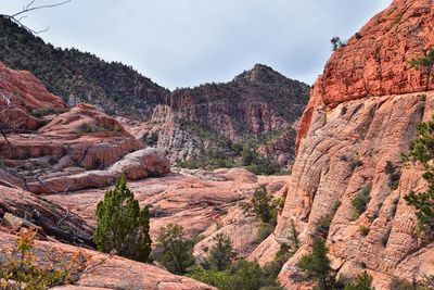 Rock formations on landscape against sky