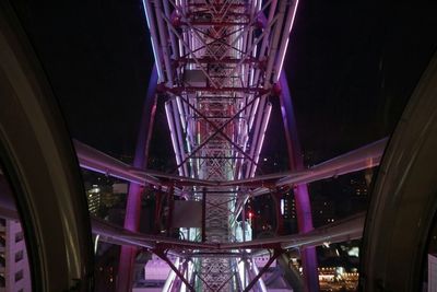 Low angle view of illuminated lights at night