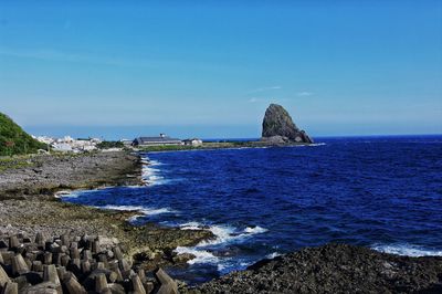 Scenic view of sea against clear blue sky