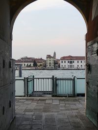 Buildings in town against sky