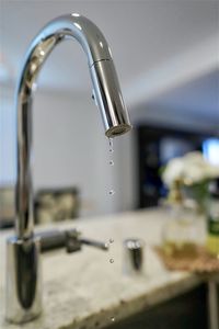 Close-up of water from faucet in bathroom