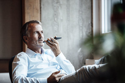 Portrait of man smoking cigarette