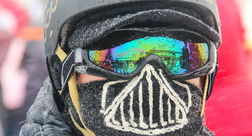 Close-up of person wearing mask during winter