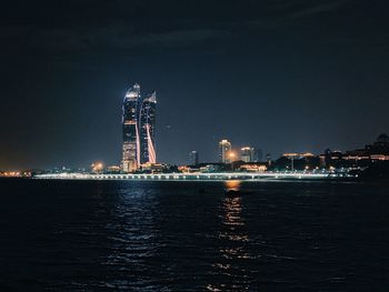 Illuminated buildings in city at night