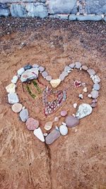 High angle view of heart shape on stone