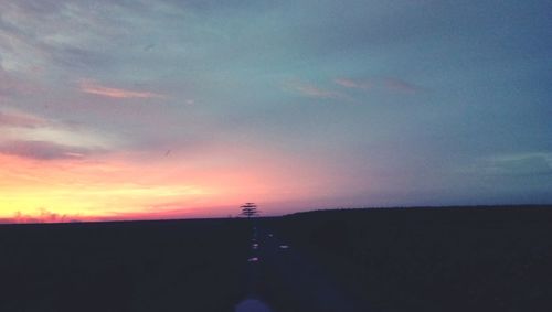 Scenic view of silhouette landscape against sky during sunset