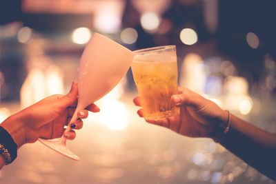 Midsection of woman holding drink