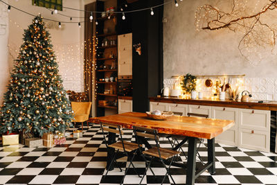 The interior of a christmas decorated kitchen in the loft style in a cozy house