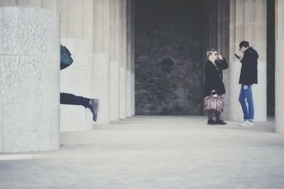 People standing against wall