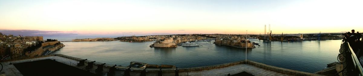 Panoramic view of city at sunset