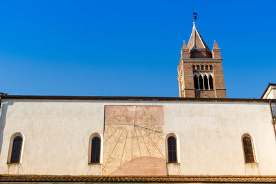 Low angle view of building against clear blue sky