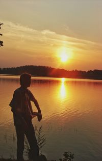 Scenic view of lake at sunset