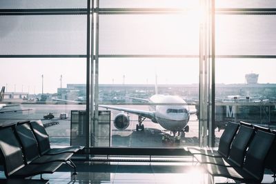 View of airport runway seen through window