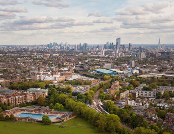 High angle view of buildings in city against sky