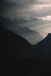 Scenic view of silhouette mountains against sky