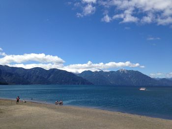 Scenic view of mountains against cloudy sky