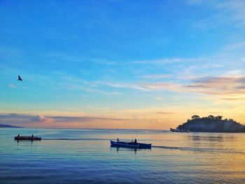 Scenic view of sea at sunset