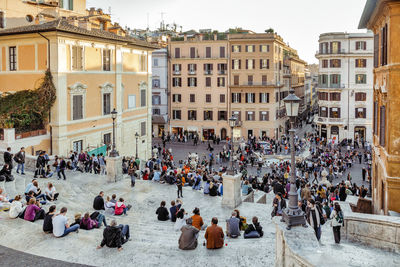 Group of people in front of buildings