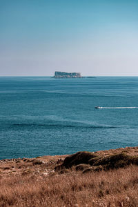 Scenic view of sea against clear sky