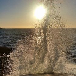 Scenic view of sea against sky at sunset