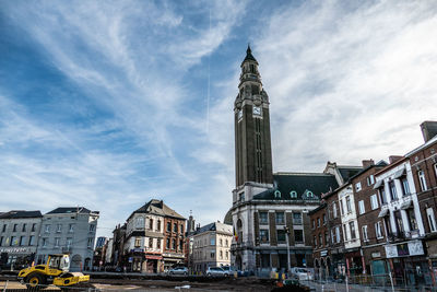 Buildings in city against sky