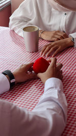 Midsection of woman holding ice cream