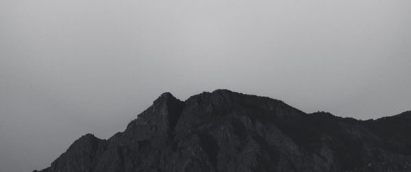 Low angle view of rock formation against clear sky