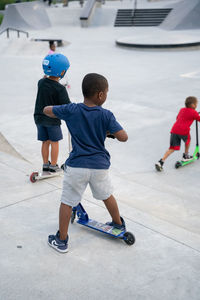 Rear view of children playing