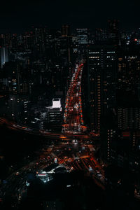 High angle view of roads in illuminated city at night