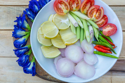 High angle view of ingredients and flowers