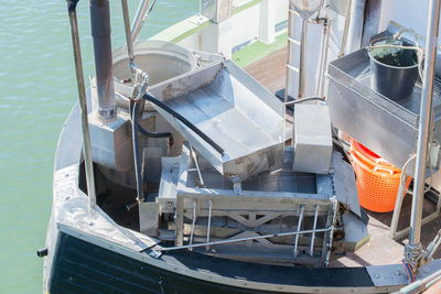 High angle view of machinery in ship moored on sea