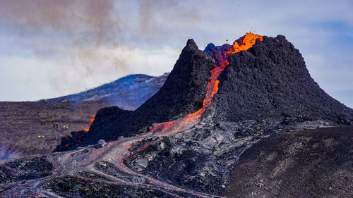 Smoke emitting from volcanic mountain at night