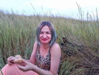 Portrait of smiling woman on field