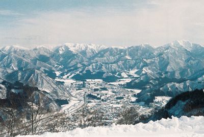 Scenic view of snow mountains against sky