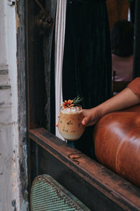 Midsection of person holding food at home