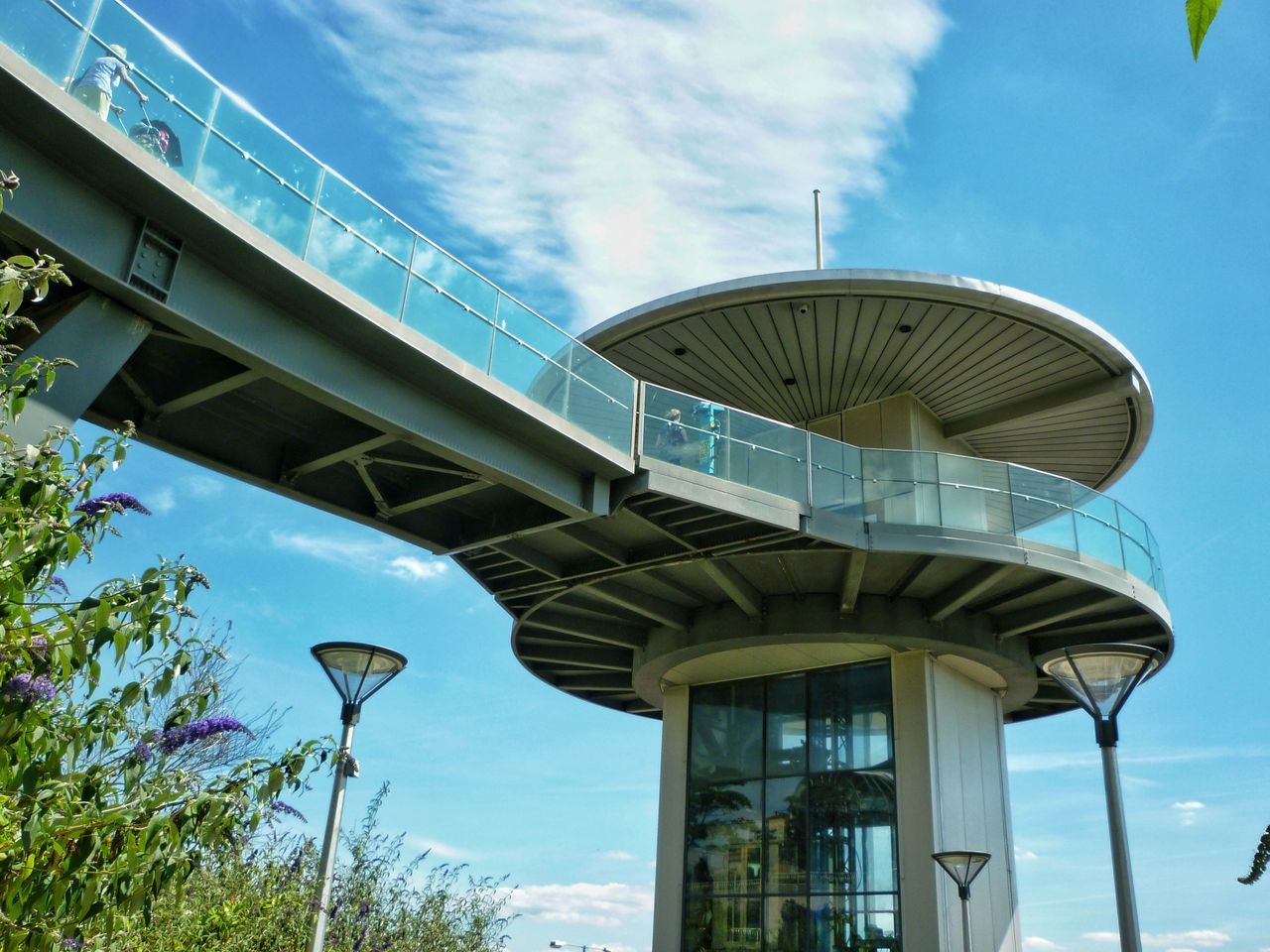 LOW ANGLE VIEW OF BUILT STRUCTURE AGAINST BLUE SKY AND CLOUDS