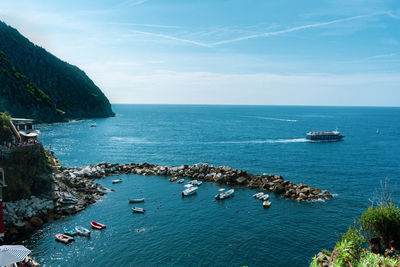 High angle view of sailboats in sea against sky