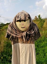 Close-up of scarecrow against sky at farm