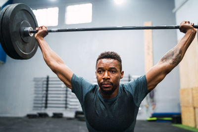 Male athlete exercising in gym